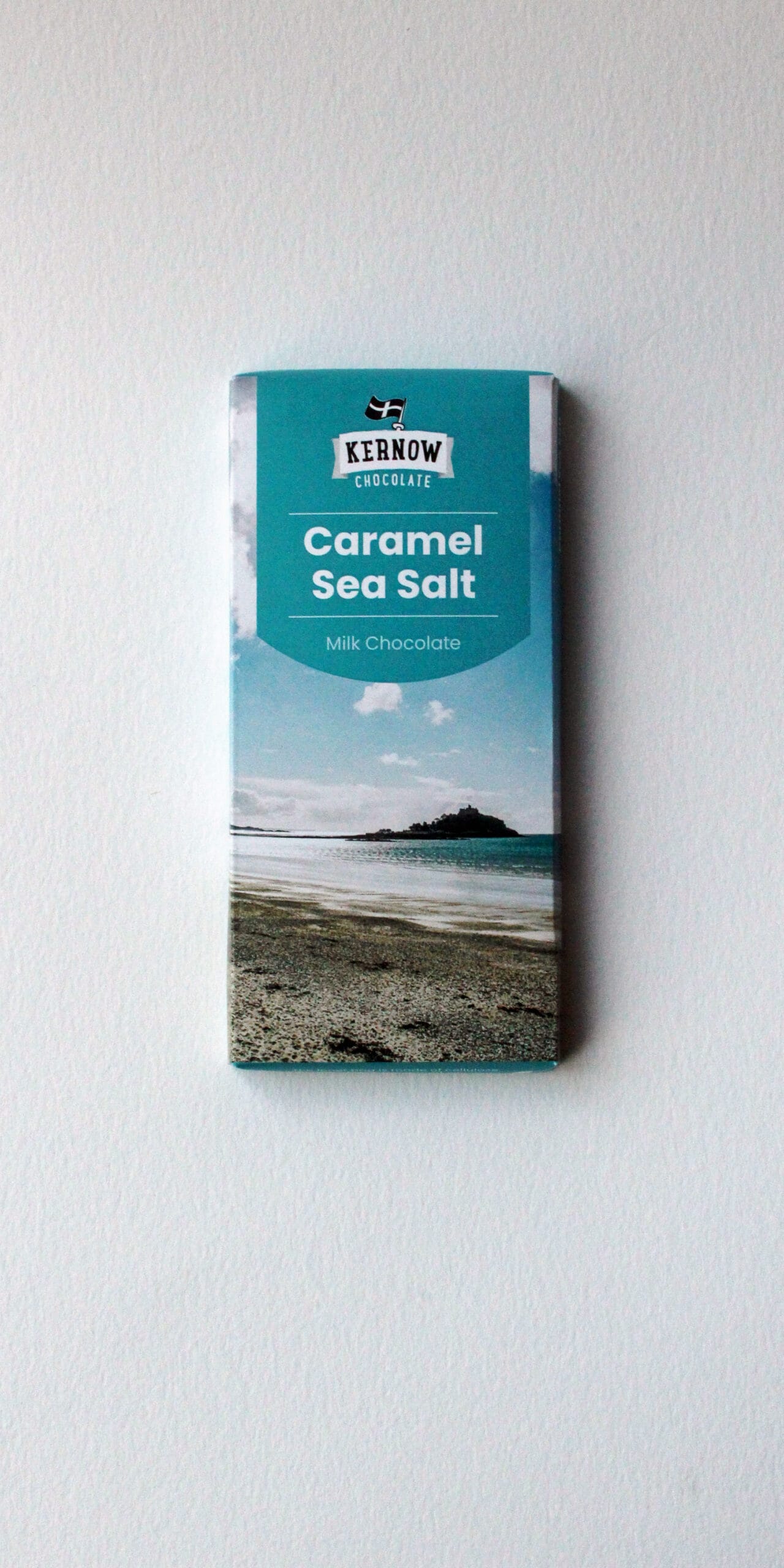 Kernow Chocolate bar with Caramel Sea Salt flavour, featuring a coastal design on the packaging.