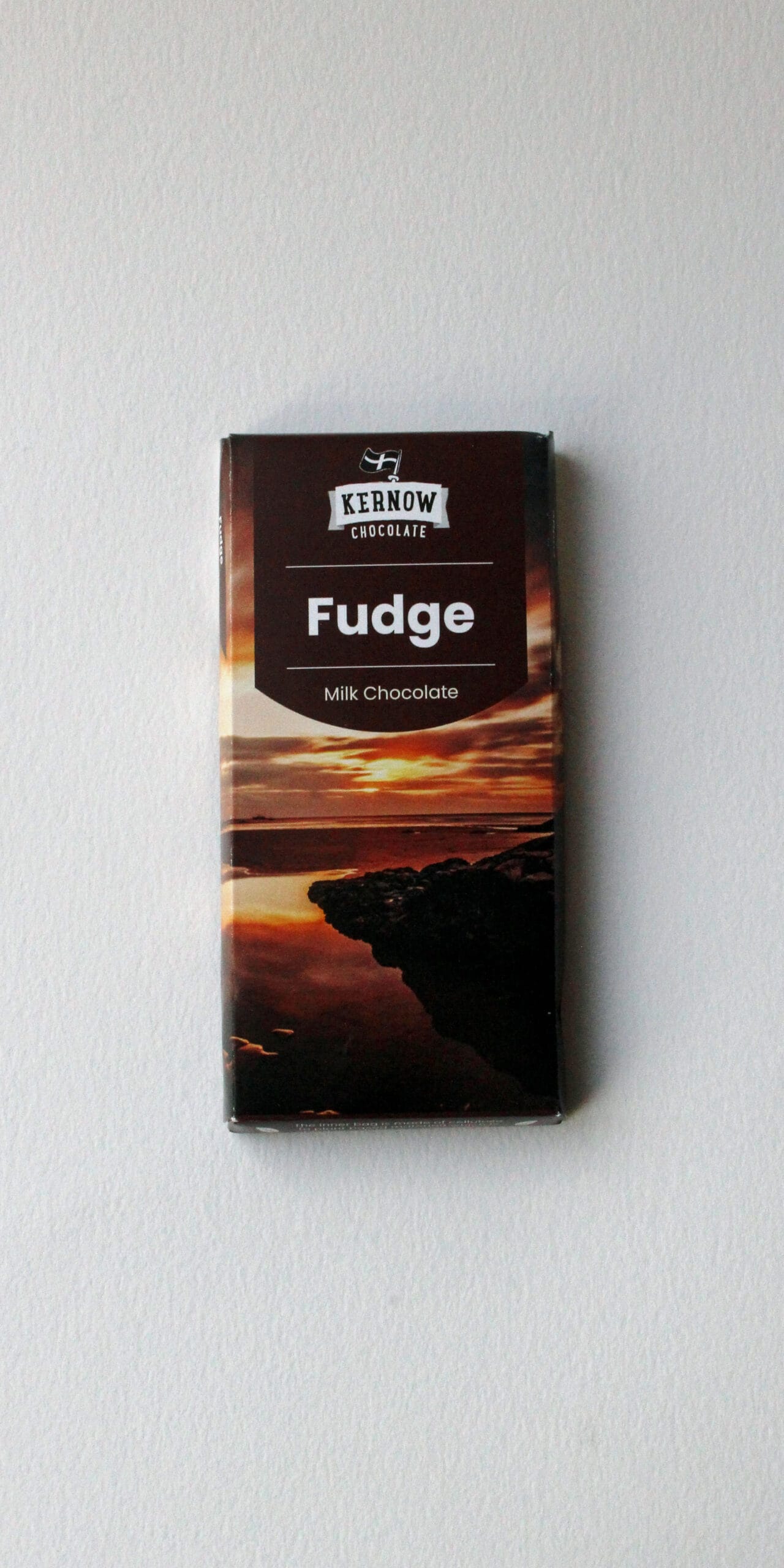 Milk chocolate fudge packaging from Kernow Chocolate, featuring a scenic sunset design.