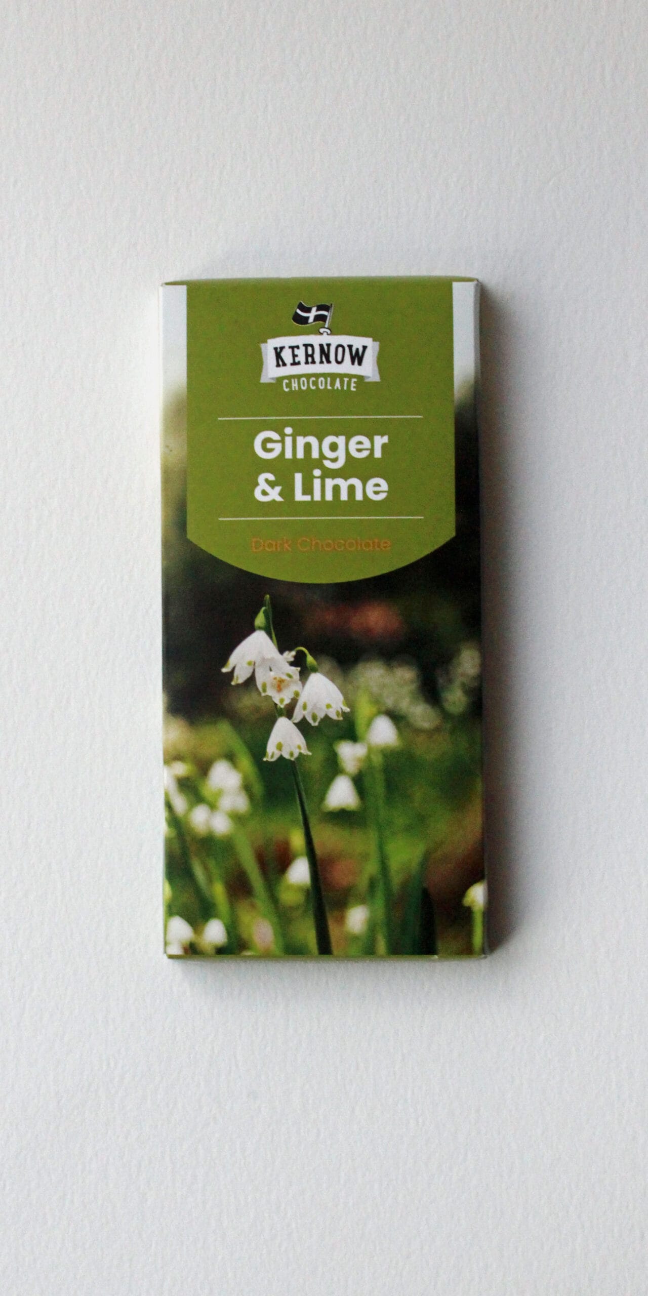 Ginger and Lime dark chocolate bar packaging with a floral design and brand logo from Kernow Chocolate.