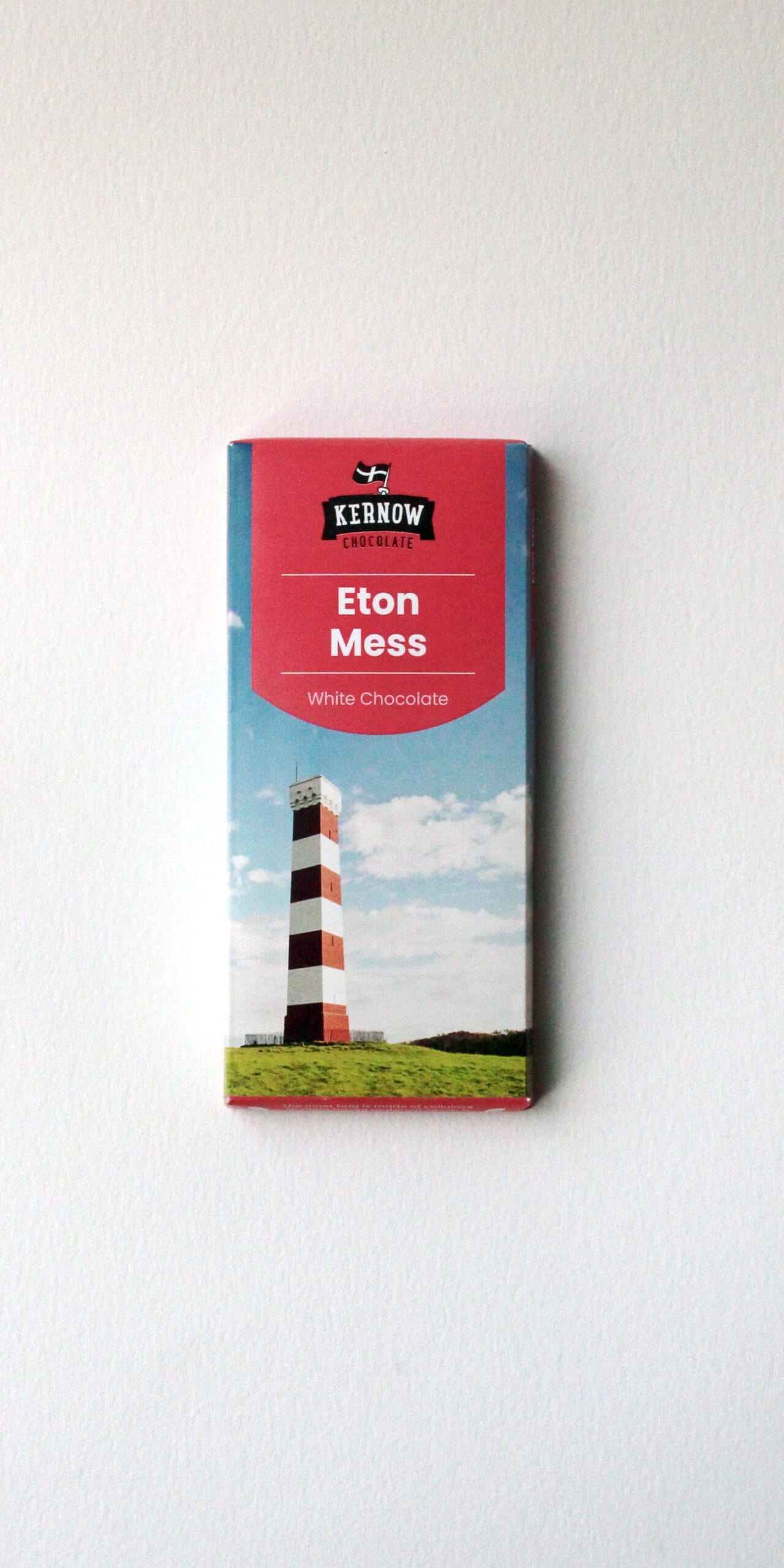 Kernow Chocolate Eton Mess white chocolate bar packaging featuring a lighthouse and blue sky.